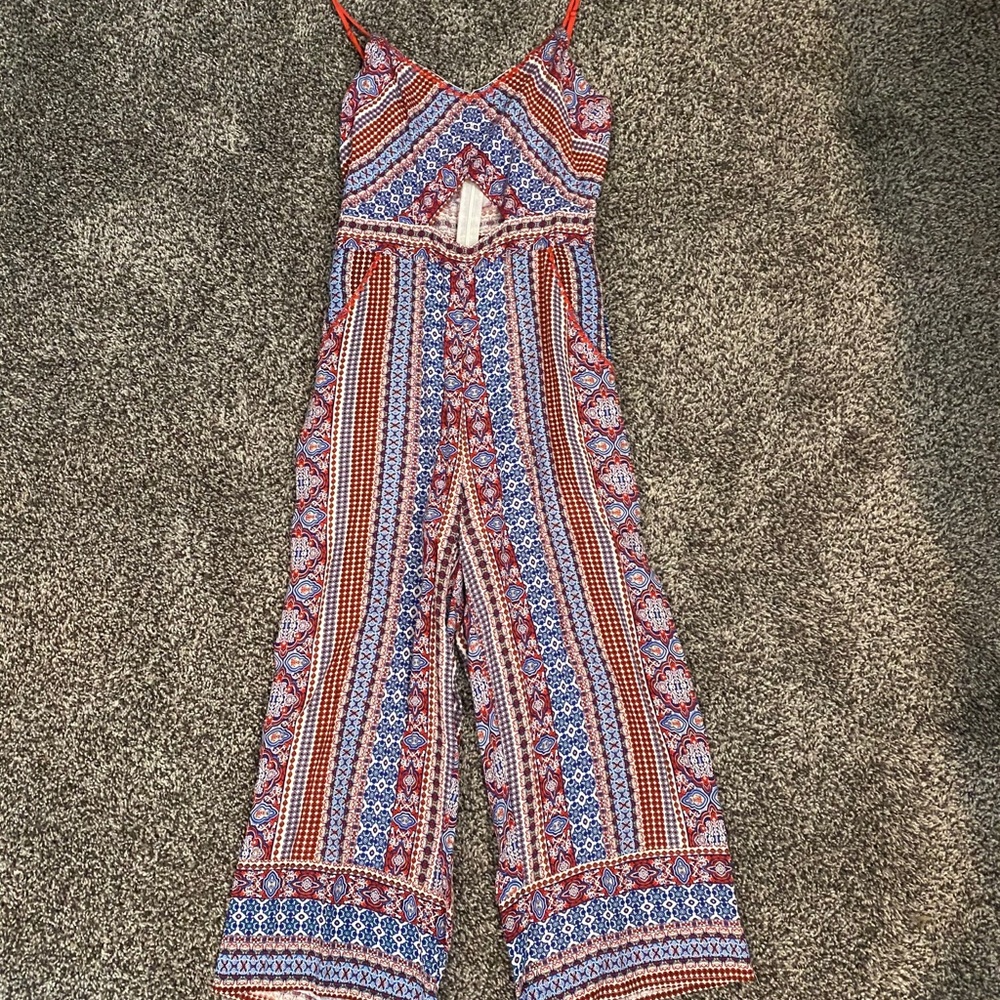 Red, white, and blue jump suite.